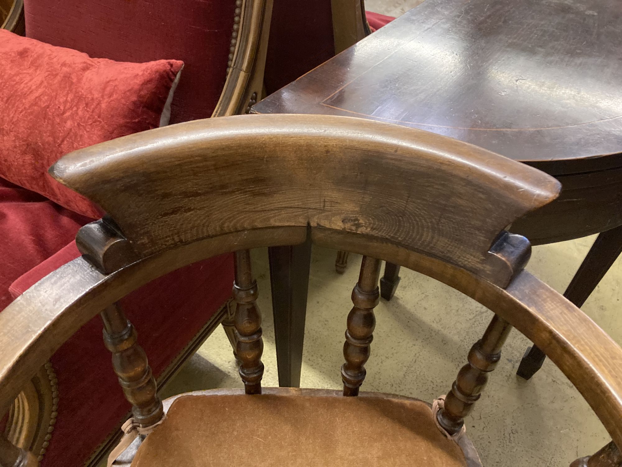 A late Victorian beech smokers bow elbow chair, width 67cm, depth 48cm, height 82cm